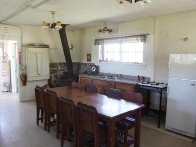 CAZIER CABINfridge, sink, woodstove, table