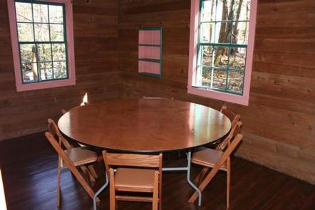 SPENCE CABIN with table and chairs in side roomdining table with chairs in one of the side rooms of Spence Cabin