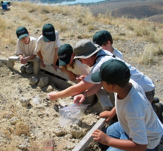 Jr Rangers Learn About PaleontologyJr. Rangers learn about paleontology at a fossil site.