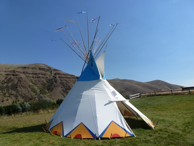 Painted TipiEvery morning in the summer Rangers put a tipi on the front lawn of the visitor center. Visitors are always welcome to help.