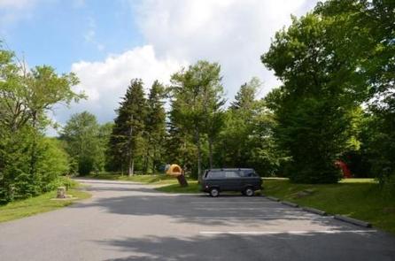 BALSAM MOUNTAIN CAMPGROUND Parking areaParking showing vehicle and trees at walk in camp area